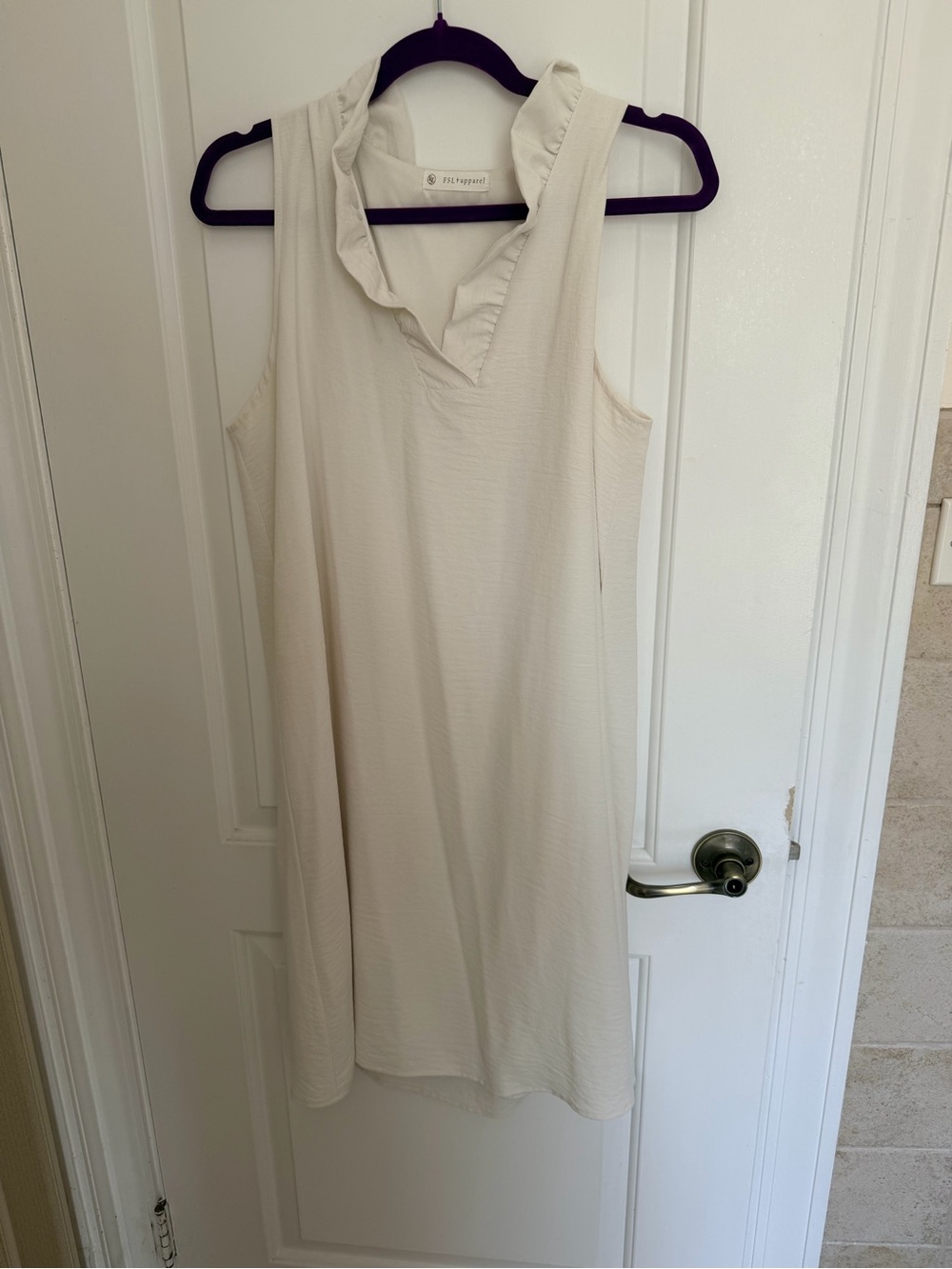 FSL Apparel Sleeveless Cream Ruffled Collar Dress